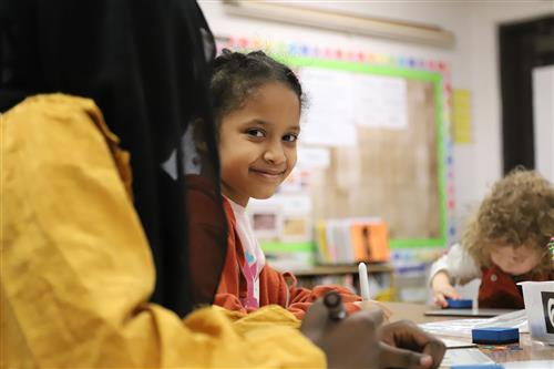 Student smiling at the camera